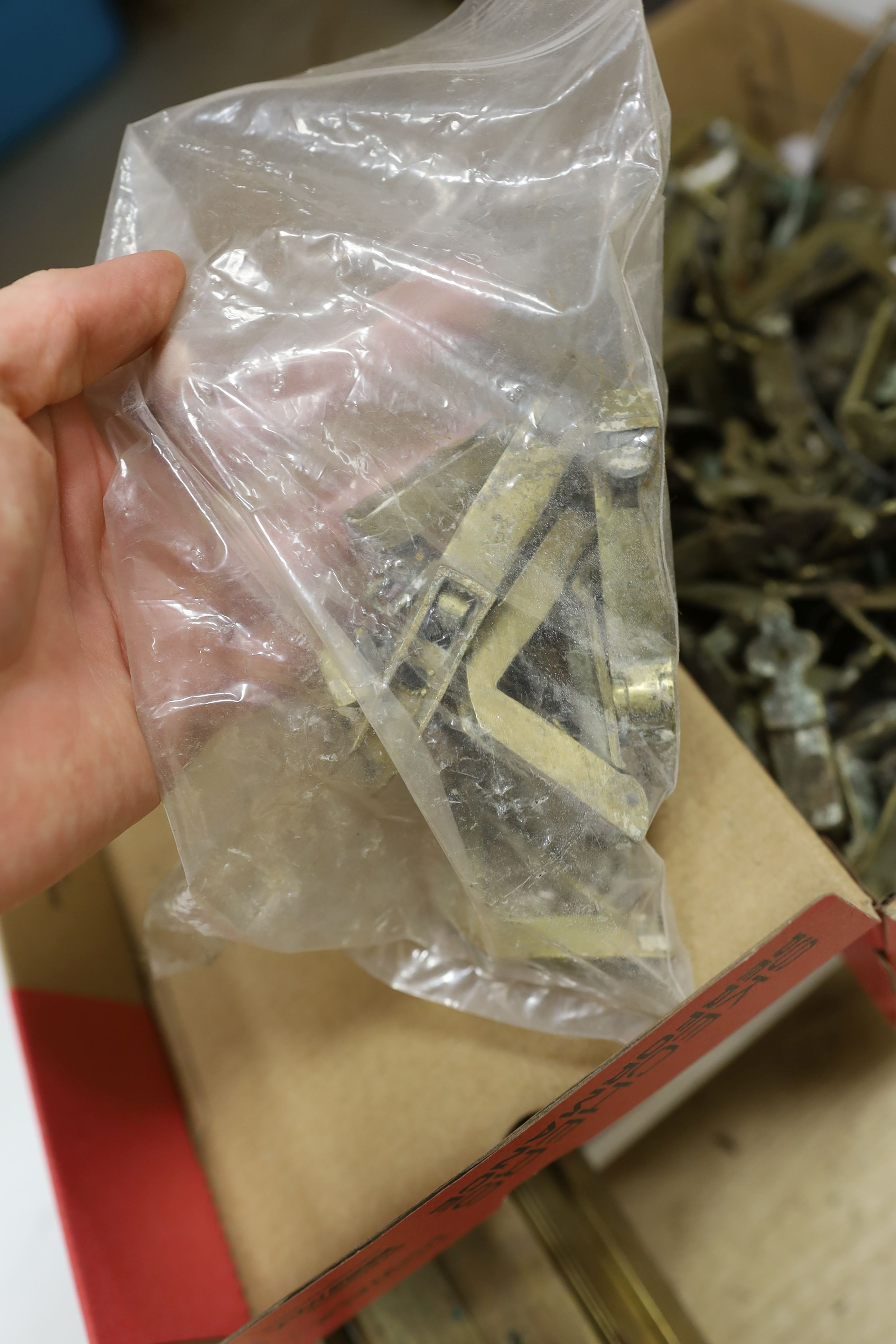 Two sets of brass stair rods with fittings.